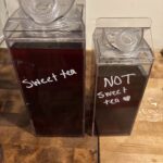Sweet Tea and Unsweet Tea in Plastic Milk Pitchers sitting on a table