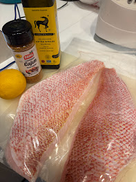 Red Snapper with olive oil, lemon, and cajun seasoning before starting to cook