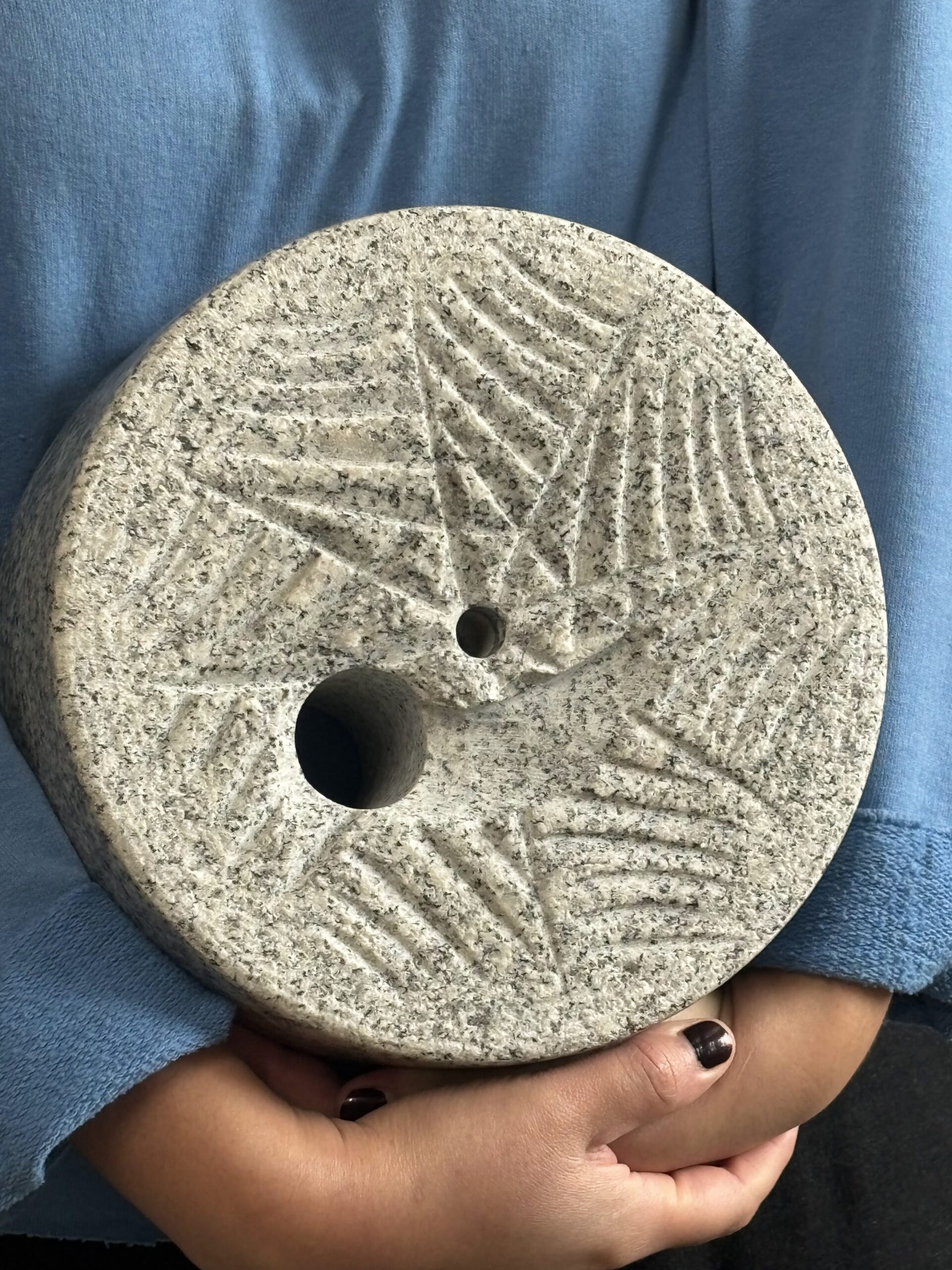 A grinding stone cut out to look like sourdough bread at Barton Springs Mill